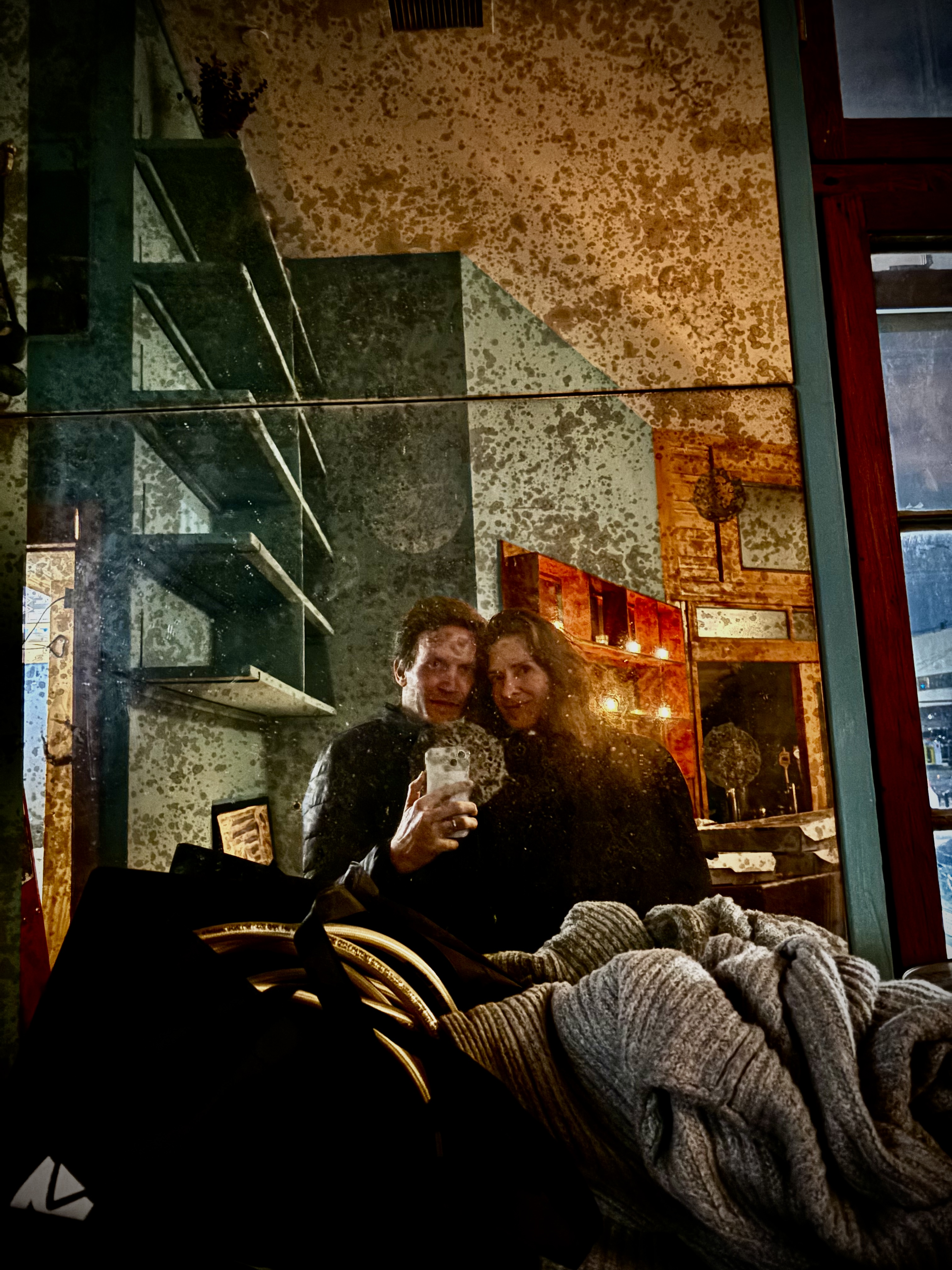 Two guests taking a mirror selfie during the Piano Funeral night.