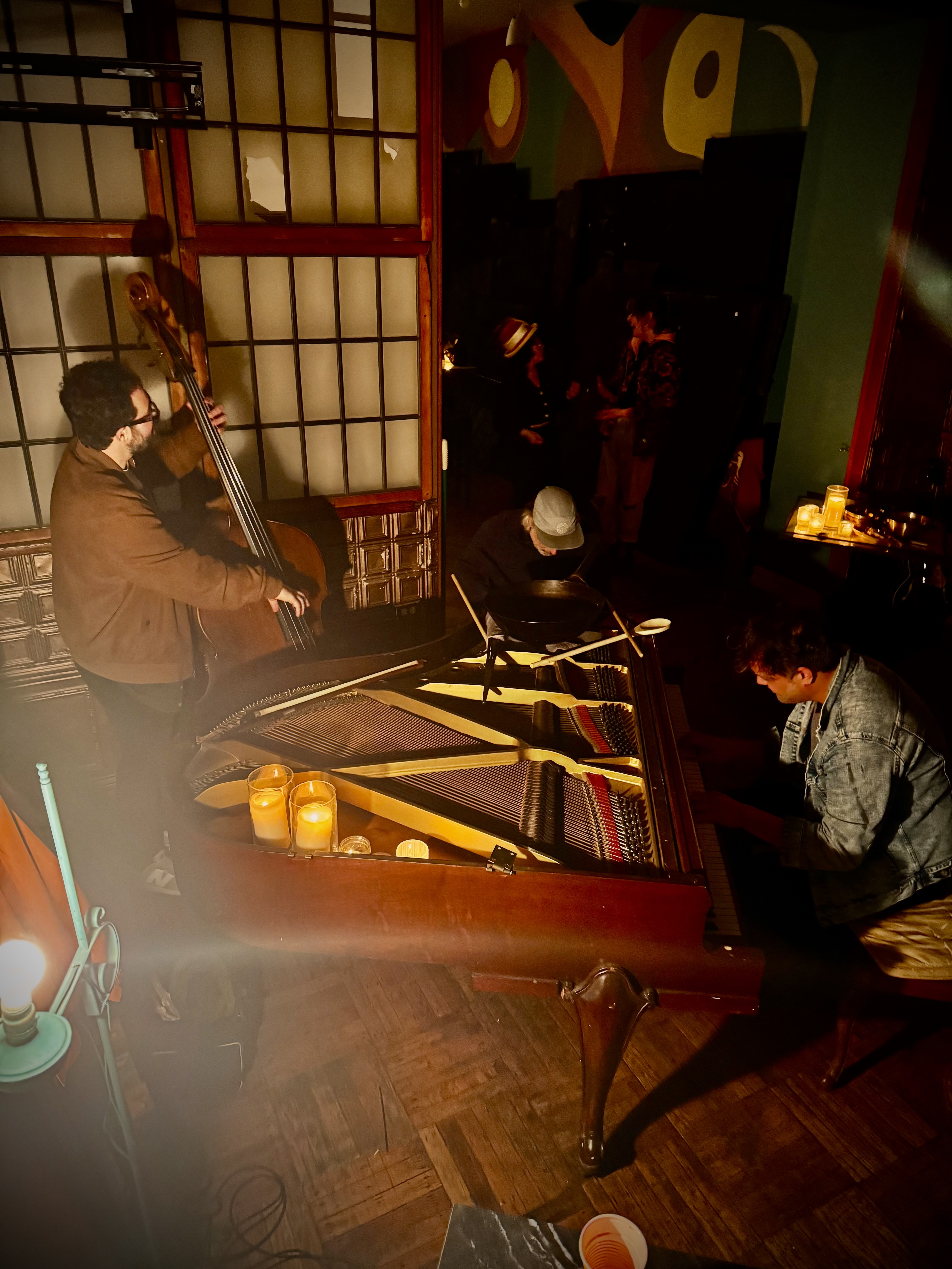 An overhead view of the piano and players during the night.